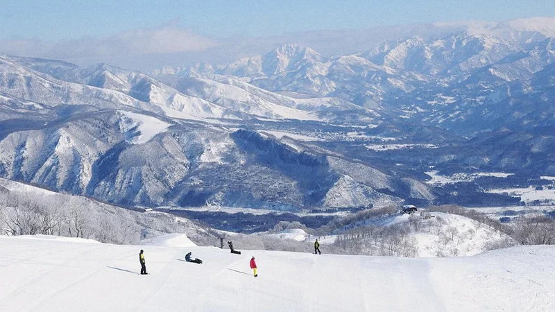 Image description: Skiers at the Hakuba Goryu Snow Resort, in Japan