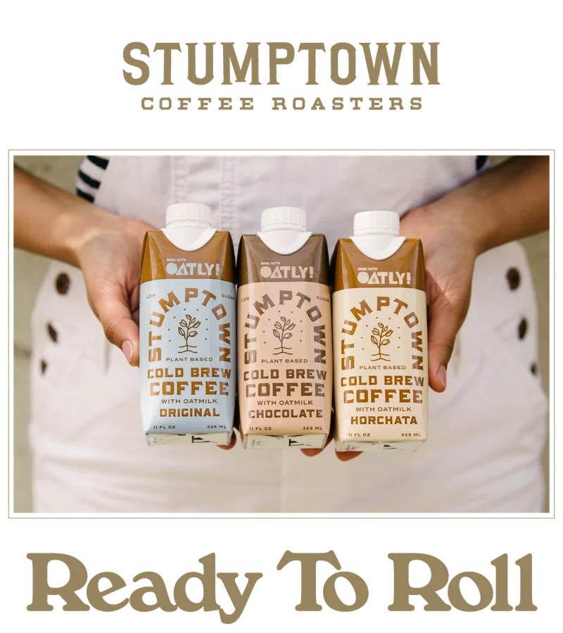 Stumptown Cold Brew with Oatly cartons (Original, Chocolate, and Horchata) held in both hands, with the headline “Ready To Roll”.