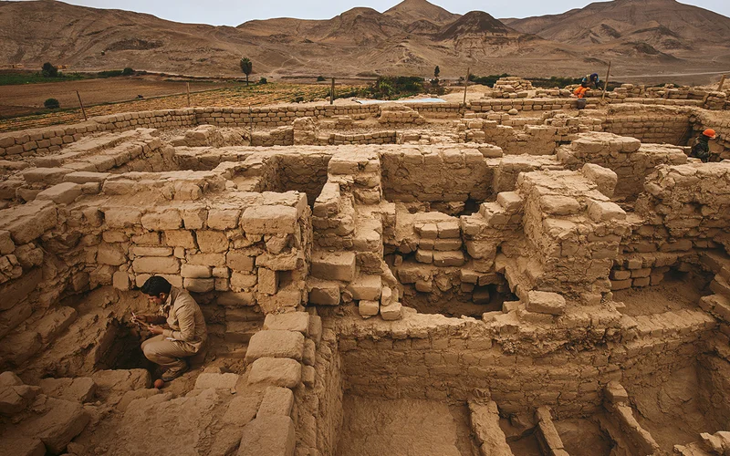 Archaeologist Roberto Pimentel Nita reviews a find in the intricate system of rooms within the mausoleum at El Castillo de Huarmey.