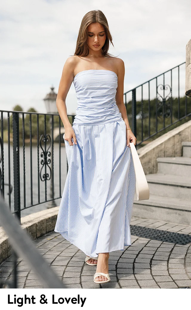 A woman wearing a strapless maxi dress.