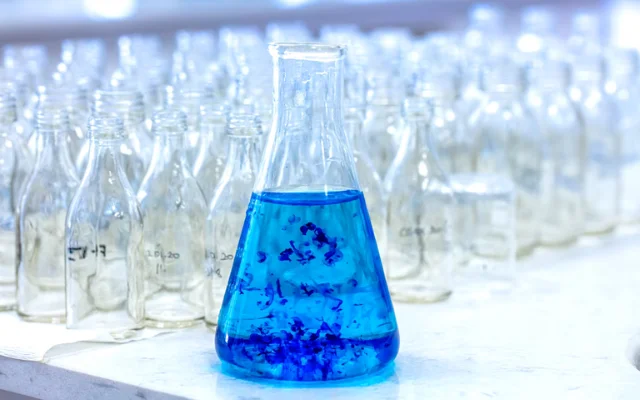 A solution of methylene blue in an erlenmeyer flask.