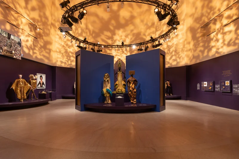 Mannequins wearing golden designer dresses
