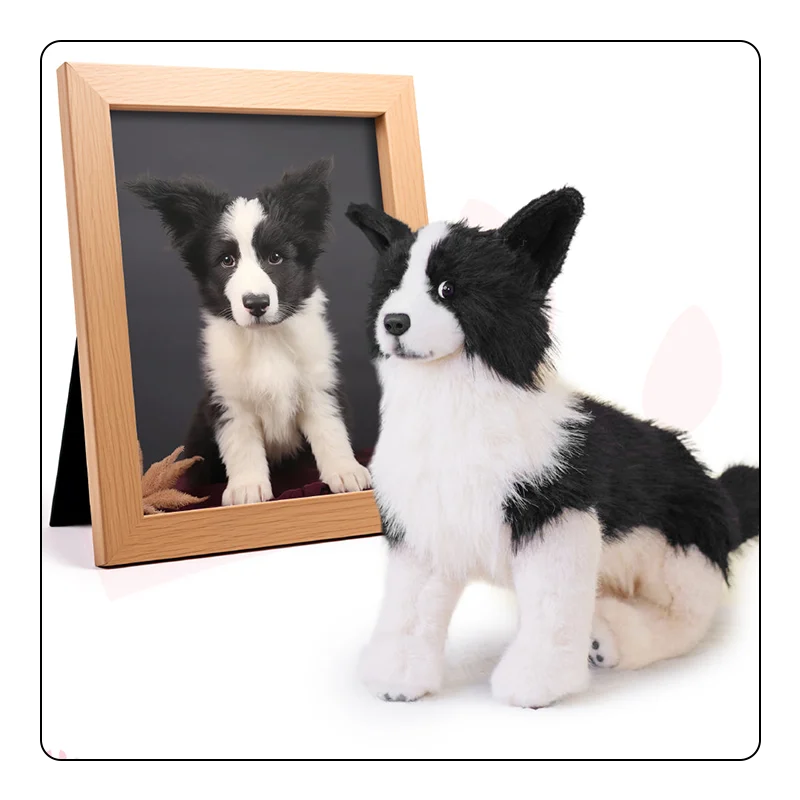 Sheepdog puppy pet replica laying next to a photo frame showing the real pet