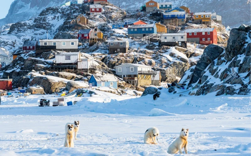 The twin mountain peaks of Uummannaq island are often veiled in fog.