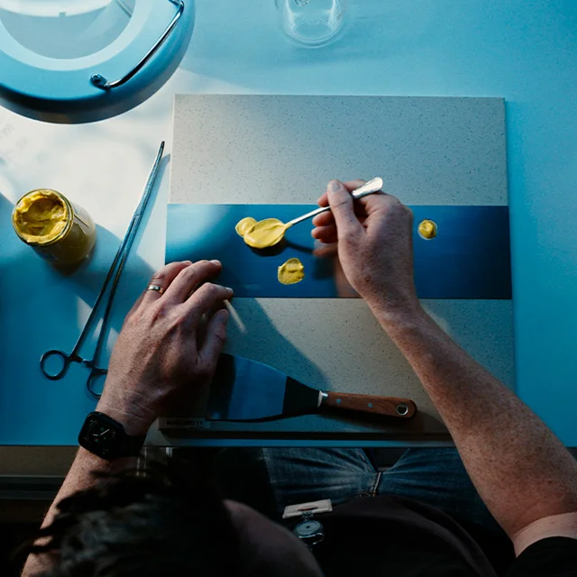 Yellow substance being applied to a surface