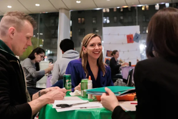 Visitors smiling while art making together