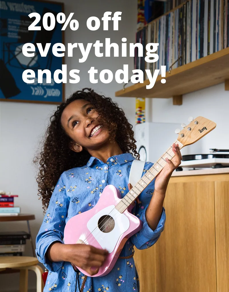 girl playing loog guitar - Memorial day sale 20% off evertyhing