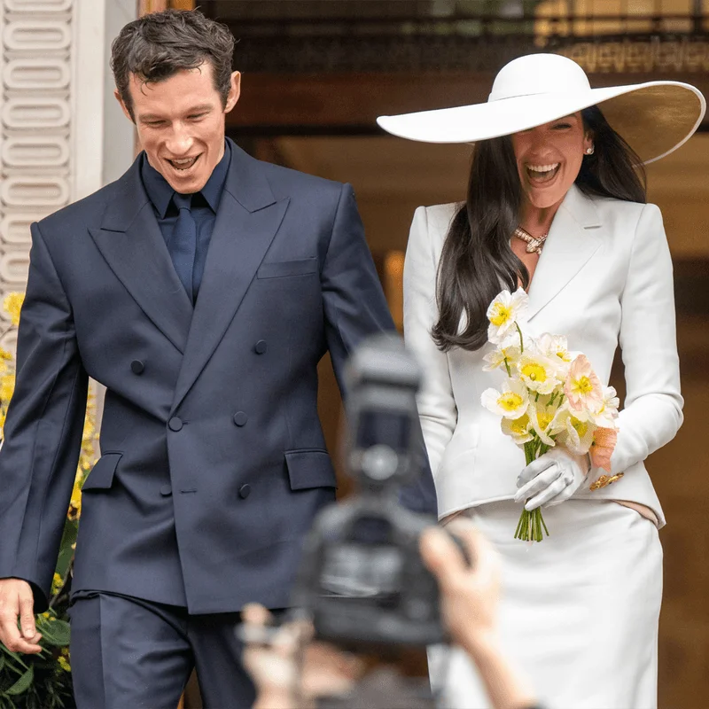Image may contain: Dua Lipa, Flower, Flower Arrangement, Flower Bouquet, Plant, Clothing, Hat, Adult, Person, and Formal Wear