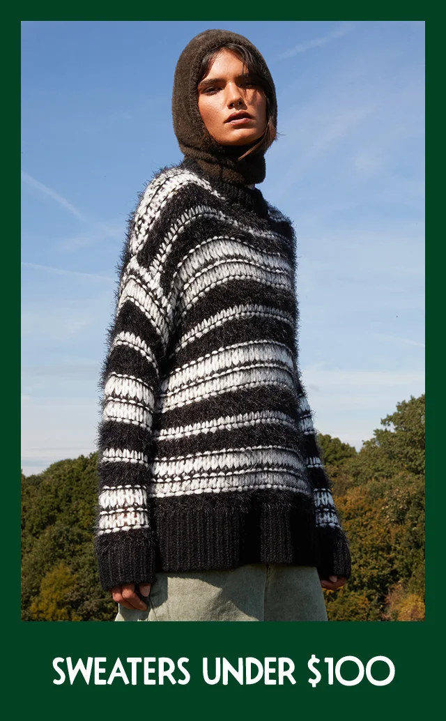 Woman wearing a Topshop sweater.