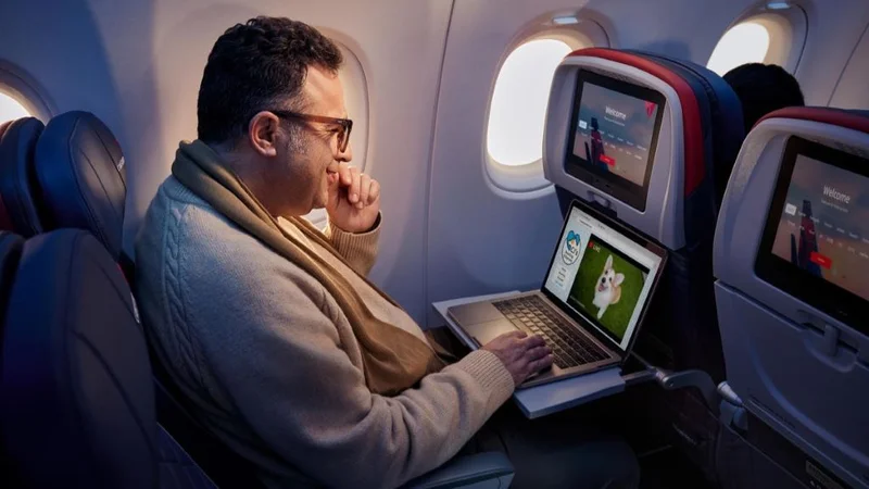 Delta customer uses free Wi-Fi onboard to watch videos.