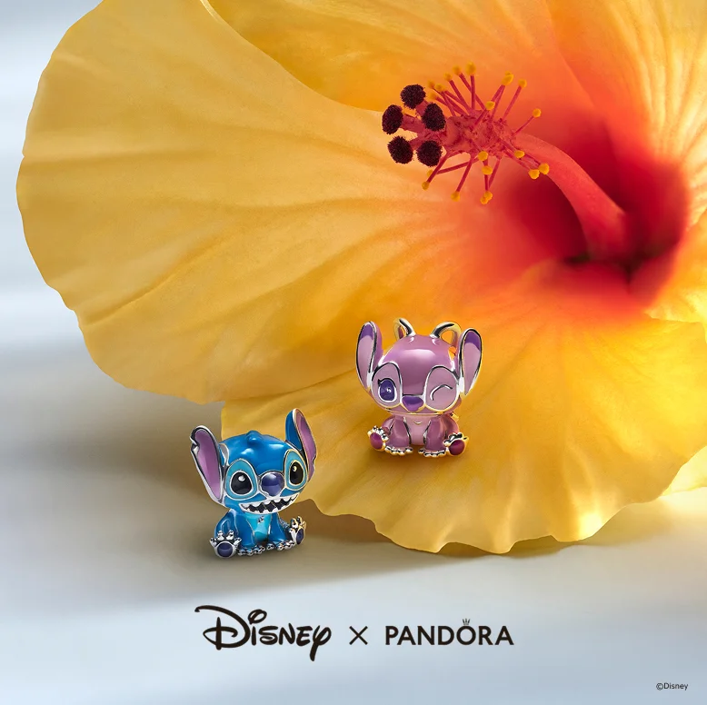 Disney x Pandora Disney's Stitch and Angel charms on a hibiscus flower