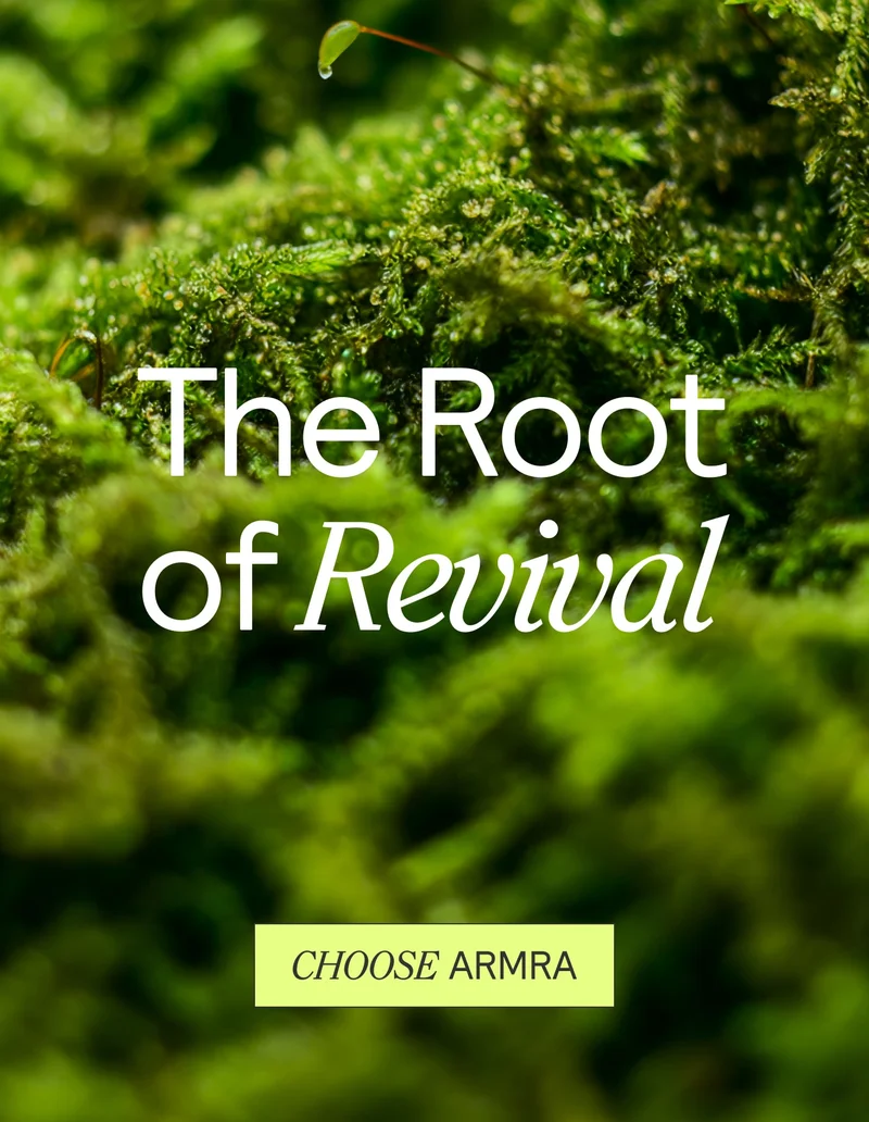 Lush green moss background with white text reading ‘The Root of Revival’ and a yellow-green button below that says ‘CHOOSE ARMRA.’