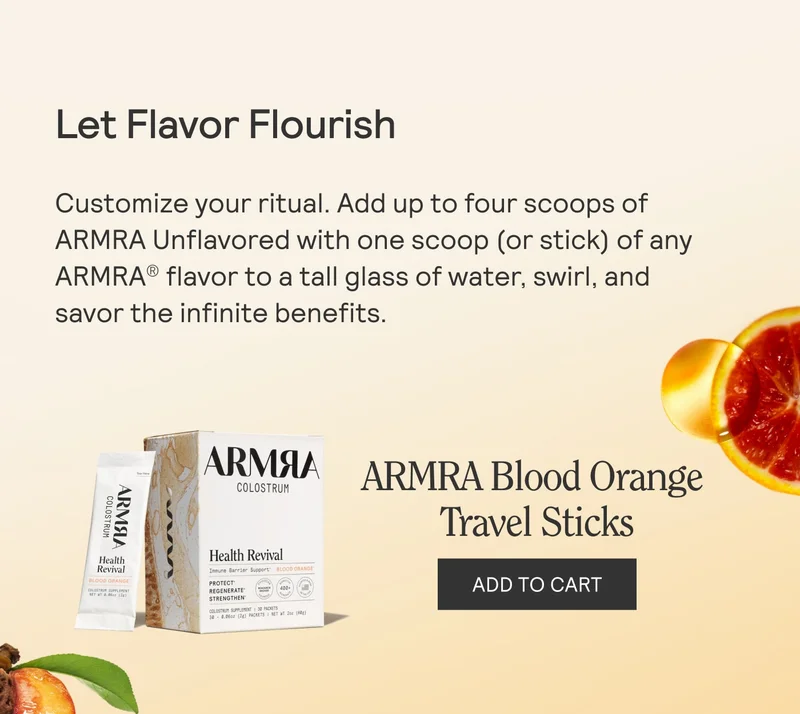 Box and stick packets of ARMRA Colostrum Health Revival Blood Orange flavor displayed next to a slice of orange on a beige background with text reading ‘ARMRA Blood Orange Travel Sticks’ and an ‘ADD TO CART’ button.