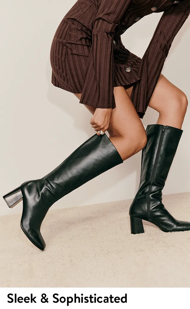 Women wearing sleek tall boots.
