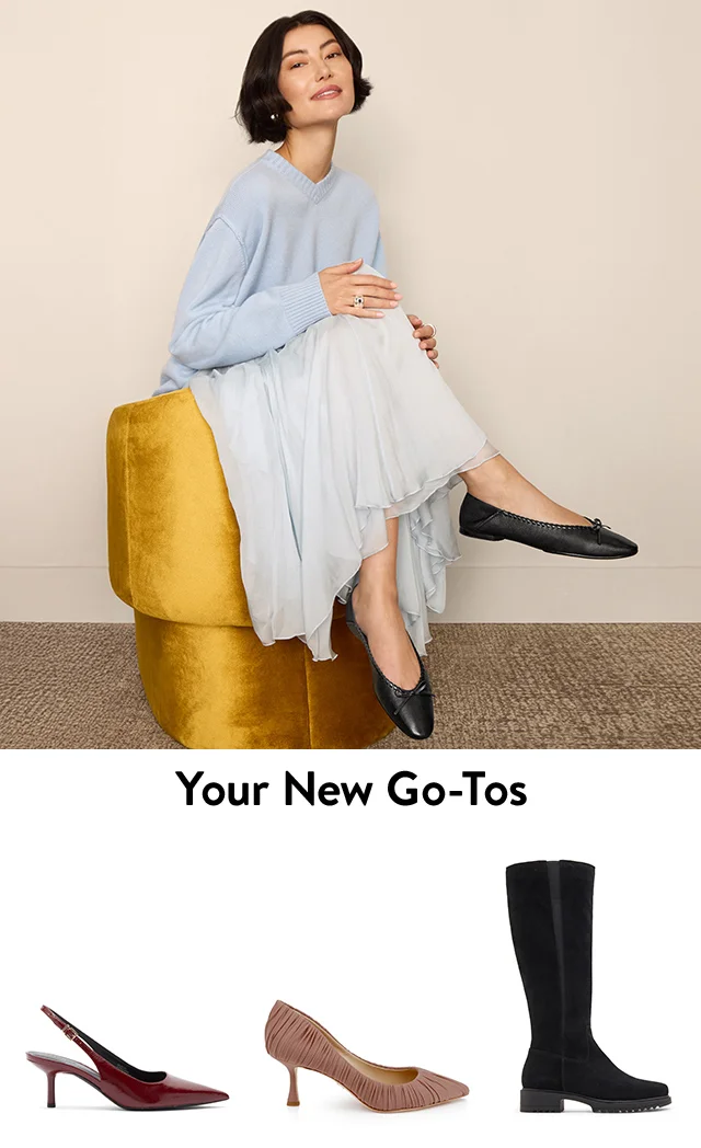 A woman wearing black flats. Black boots, burgundy slingbacks and pink pumps.