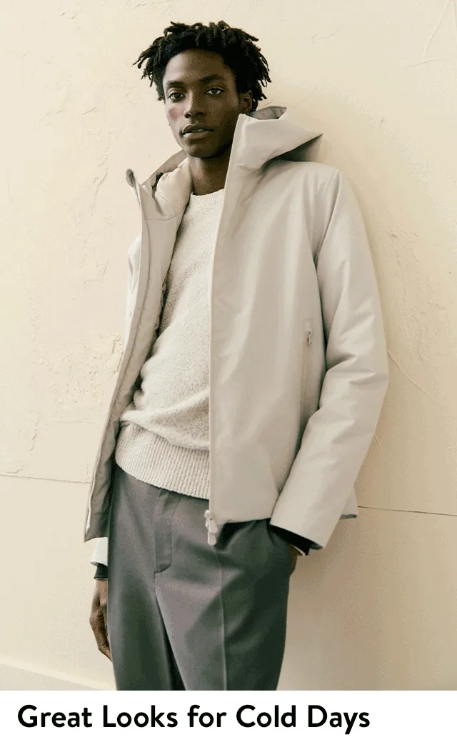 A man wearing an off-white anorak.