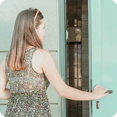a woman entering a public bathroom a woman entering a public bathroom