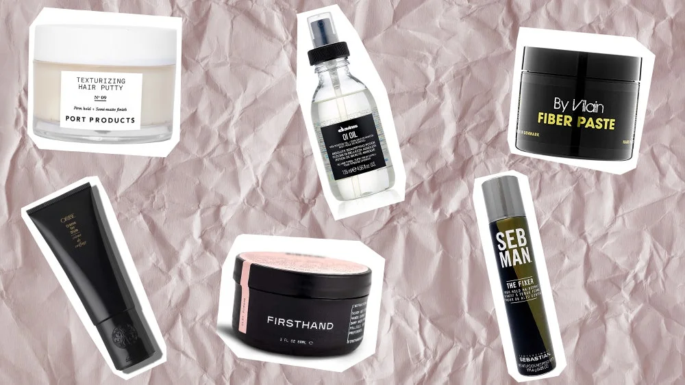 Image of hair products including By Vilain fiber styler, Firsthand Supply clay hair styler, Port Products hair putty, Sebastian SEB MAN high hold hair spray, Davines hair oil, and Oribe styling cream