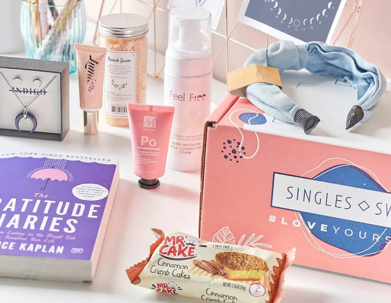 Hand-picked Mother's Day gifts: a subscription box filled with a book, snacks, jewelry, and beauty products