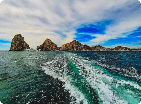 Image Description: A beach with mountains in the background.