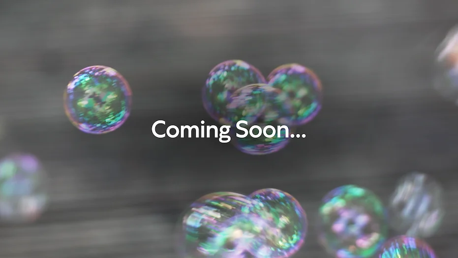 Photo of bubbles floating through the air with text superimposed "coming soon..."