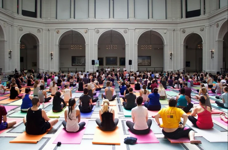 A group of people sitting on yoga mats