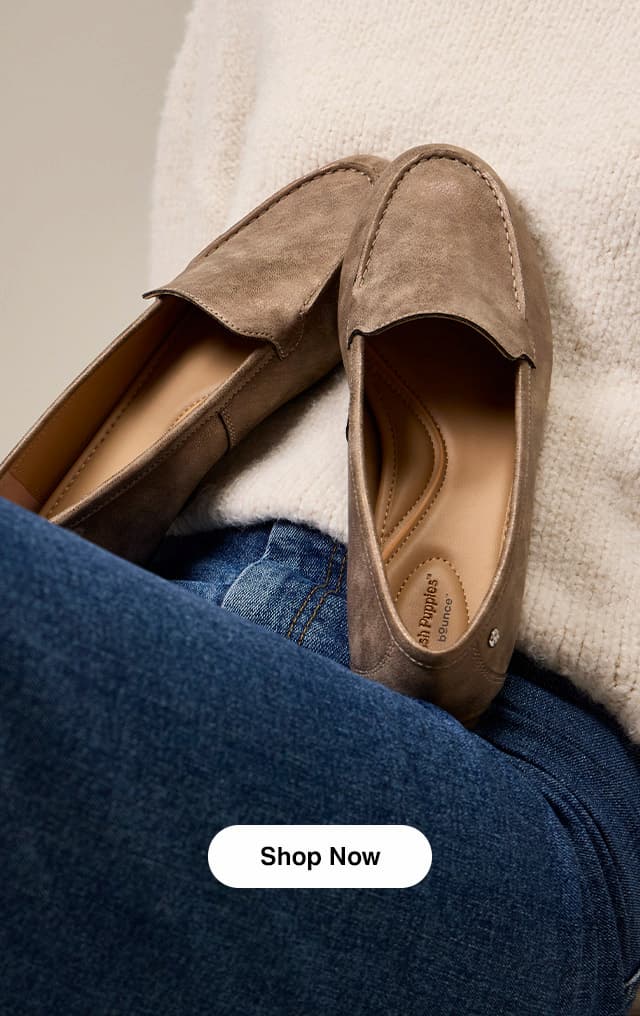 A pair of the Ozzie Loafers in Bronze set against a soft sweater. Shop Now