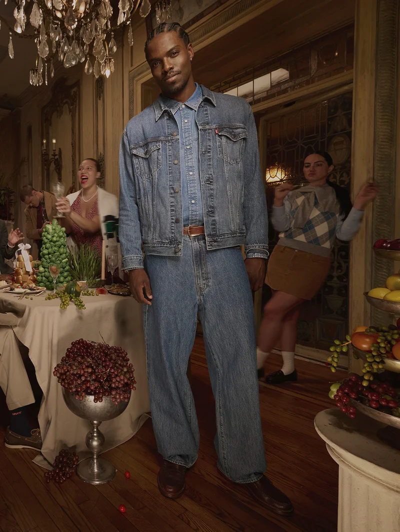 Person standing near a dinner table