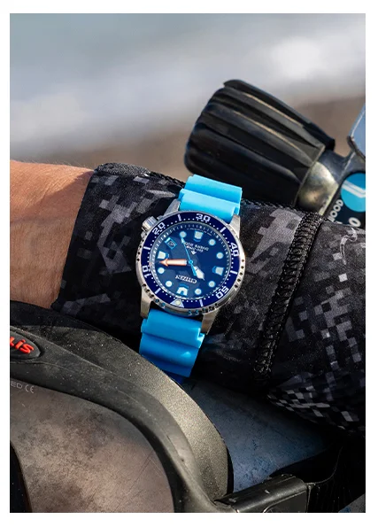 Person in diving gear wearing a blue strap Promaster Dive 37mm EO2028-06L