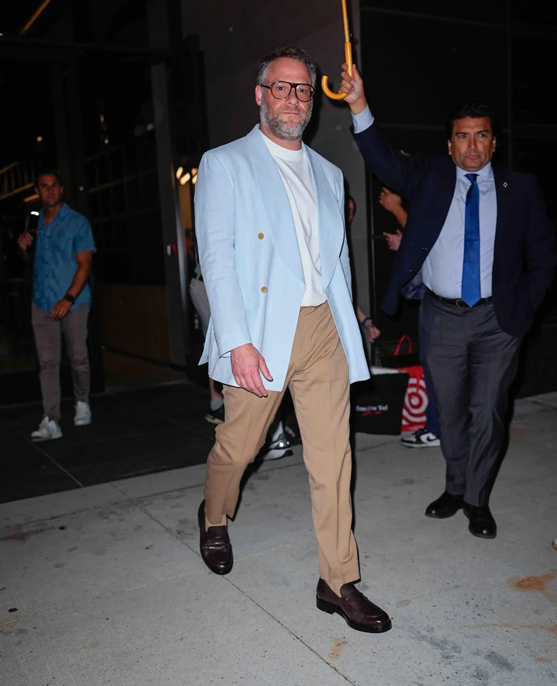 Image may contain: Seth Rogen, Clothing, Coat, Jacket, Blazer, Formal Wear, Suit, Adult, Person, People, Accessories, and Tie