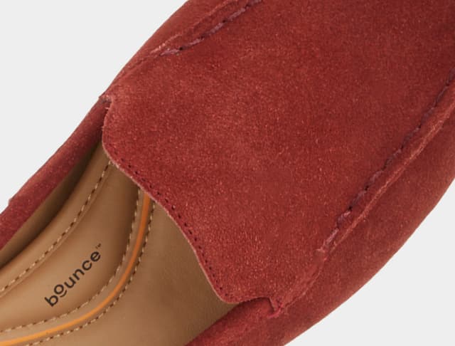 A close-up of the Ozzie Loafer in brick red suede.