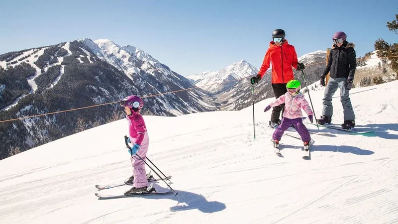 Image description: Family skiing at Aspen Snowmass.