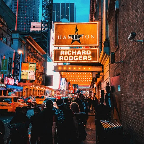 Image Description: Travelers queuing outside the Broadway Theatre to see Hamilton, a famous musical