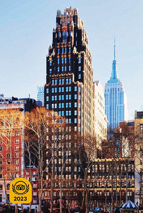 Image Description: The iconic Gothic-style American Radiator Building built with black brick and gold masonry units
