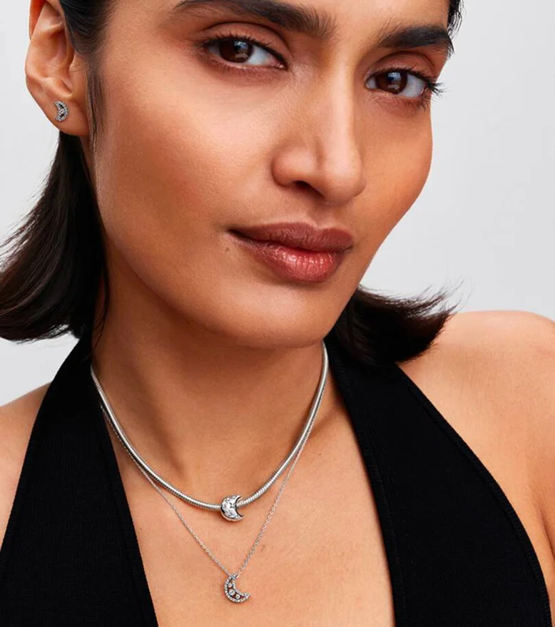 Model wearing silver necklace