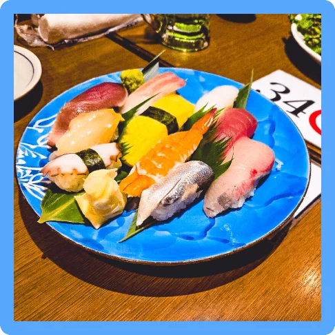 Image description: Different pieces of colorful sushi on a single plate