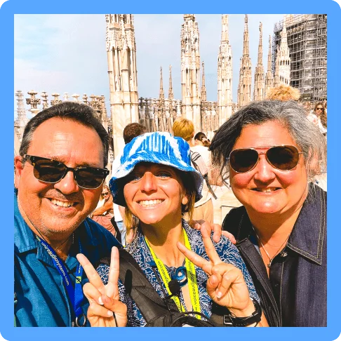 Image description: Three travelers posing for a selfie on the roof of Milan’s Duomo