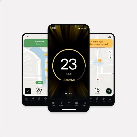 Alt text: “Three smartphone screens displaying the Cowboy bike app interface. The central screen highlights a speedometer reading 23 km/h with the text ‘Adaptive,’ while the side screens show navigation maps and alerts such as ‘Well done’ and ‘Careful now, wild crossroad ahead.’”