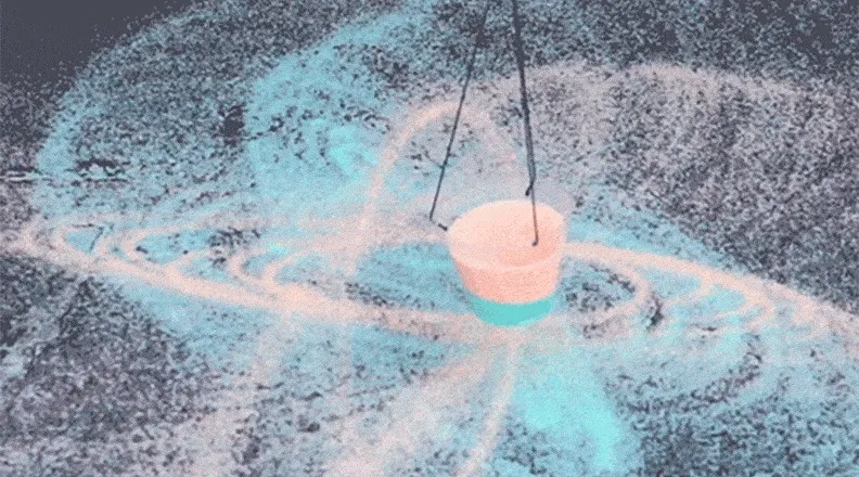 A close-up GIF of a swinging pendulum dispersing white salt in elegant, swirling patterns across a dark surface.