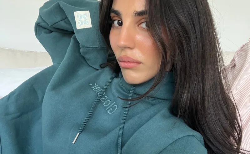 Tahlia wearing Glossier hoodie