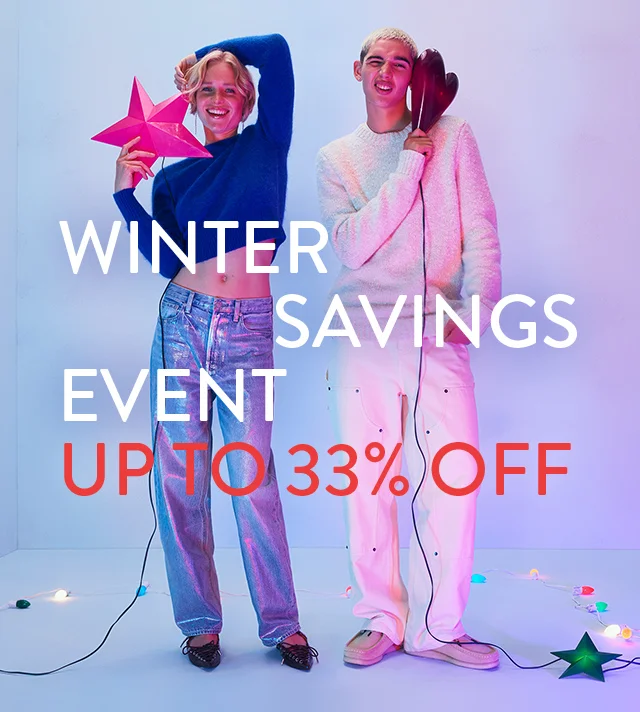 Winter savings event: up to 33% off. A woman and man wearing sweaters and jeans.