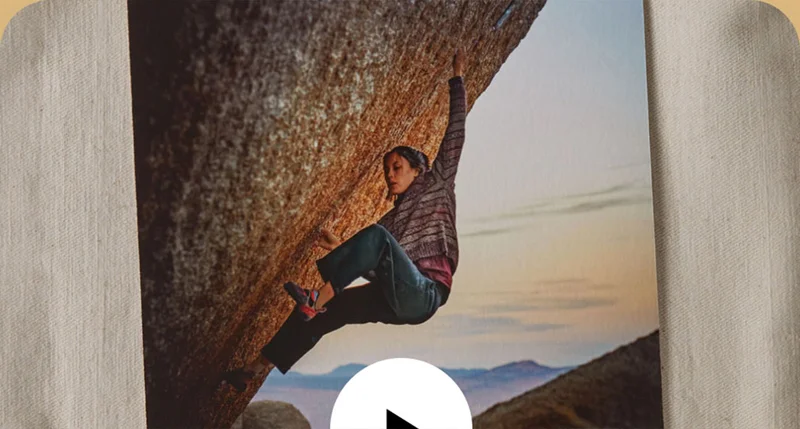 A climber on an overhanging boulder problem.