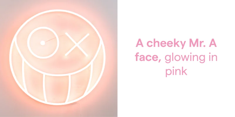A cheeky Mr. A face, glowing in pink