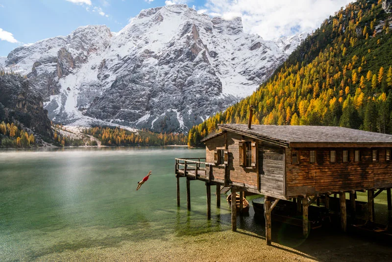 A person dives into Lago di Braies (Lake Braies) in the Tyrol.