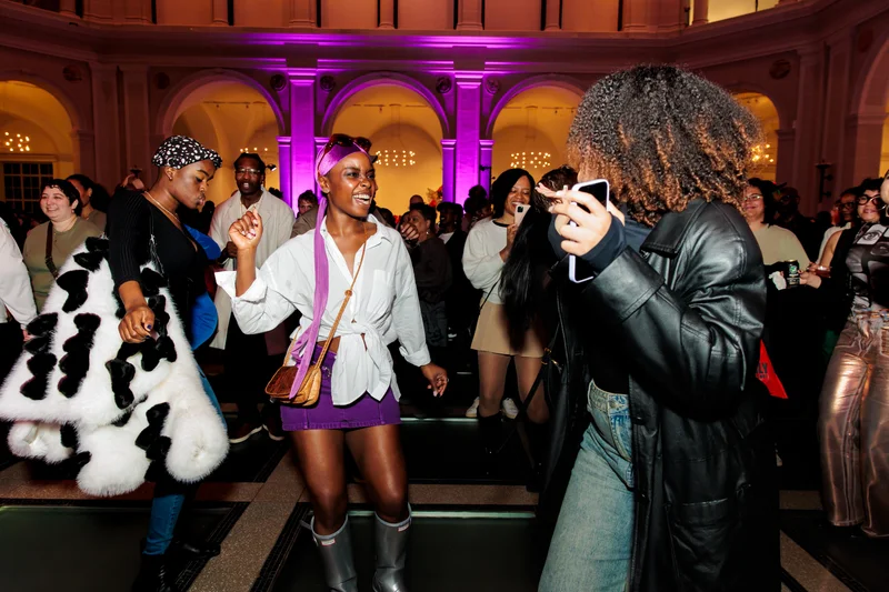 Visitors dancing together