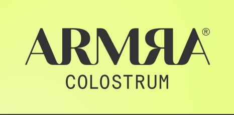ARMRA Colostrum logo in black text on a yellow-green background.