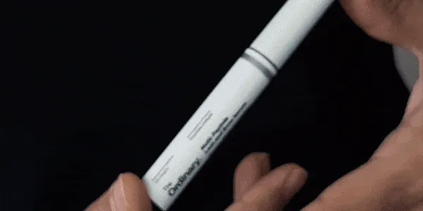 Gif image of Chris applying L&B Serum.