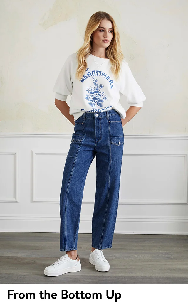 A woman wearing cargo jeans and a graphic T-shirt.