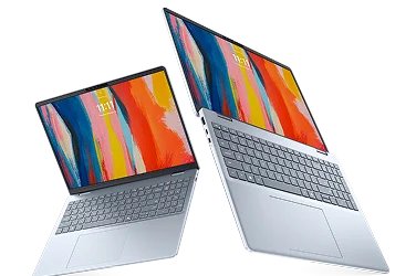 Two Dell 16 Plus laptop computers floating in midair.
