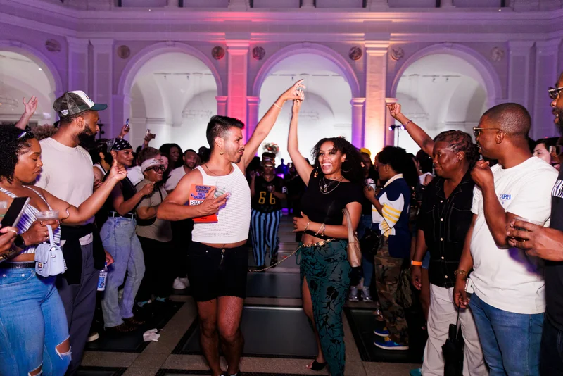 Two people dancing in a crowd